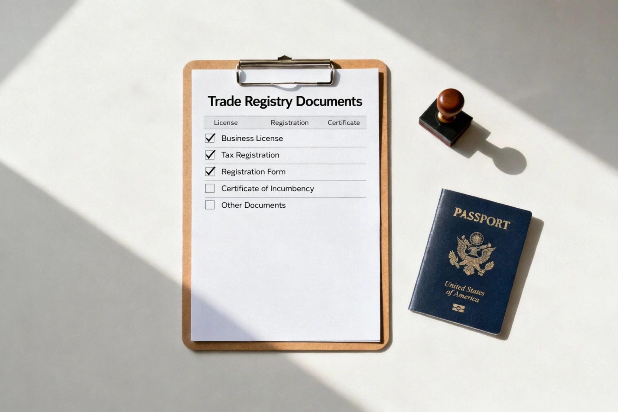 Checklist of trade registry documents on a clipboard beside a passport and company stamp, illustrating business registration requirements.